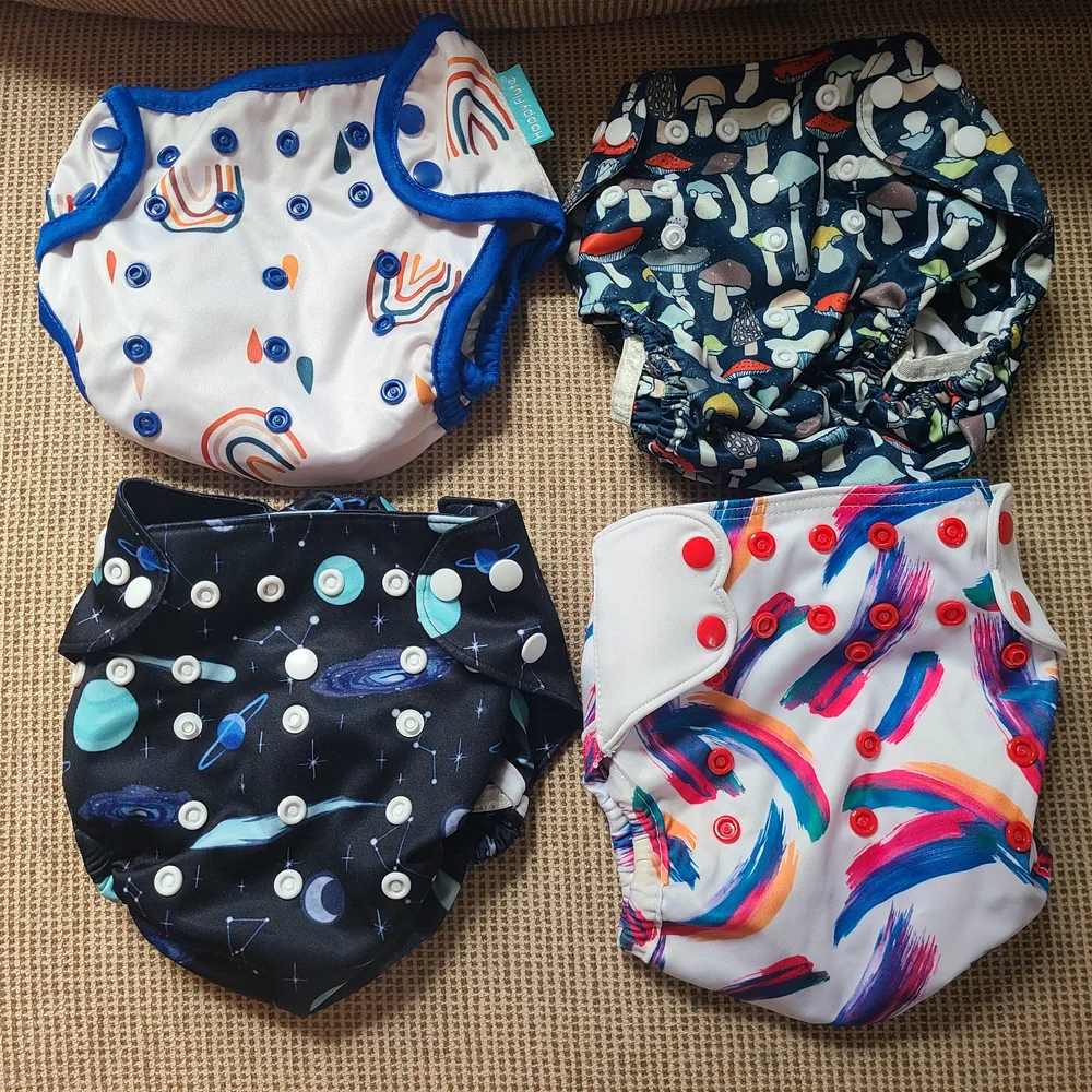 FOUR BAYRLI HEAVY WETTER CLOTH DIAPERS AND COVERS